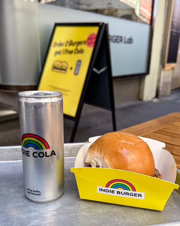 View of a burger and a cola can