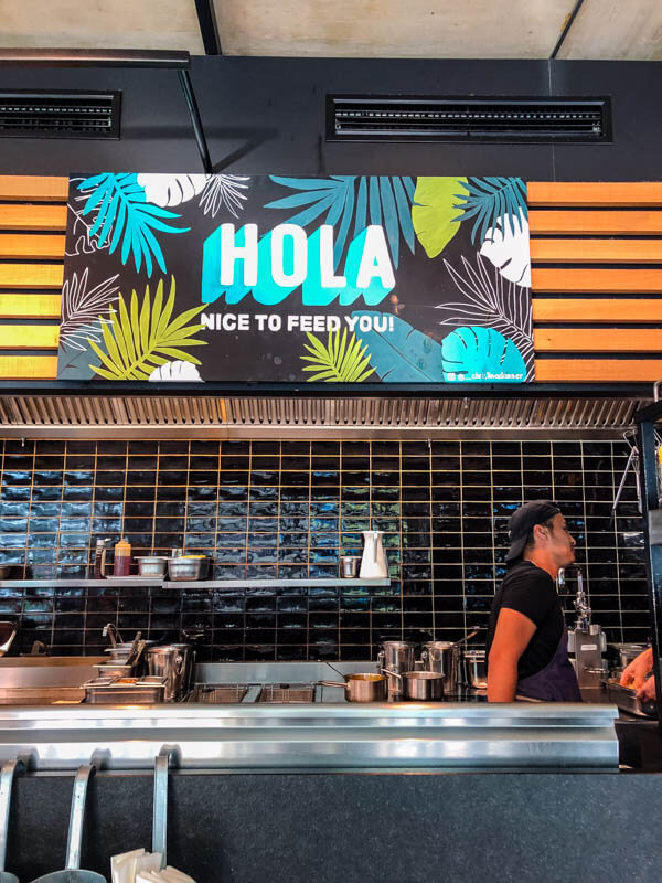 A sign "Hola, nice to feed you!" in the Kunsthauscafe in Graz