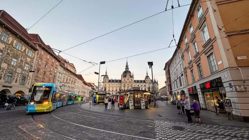 A tram is passing by through Graz' main square