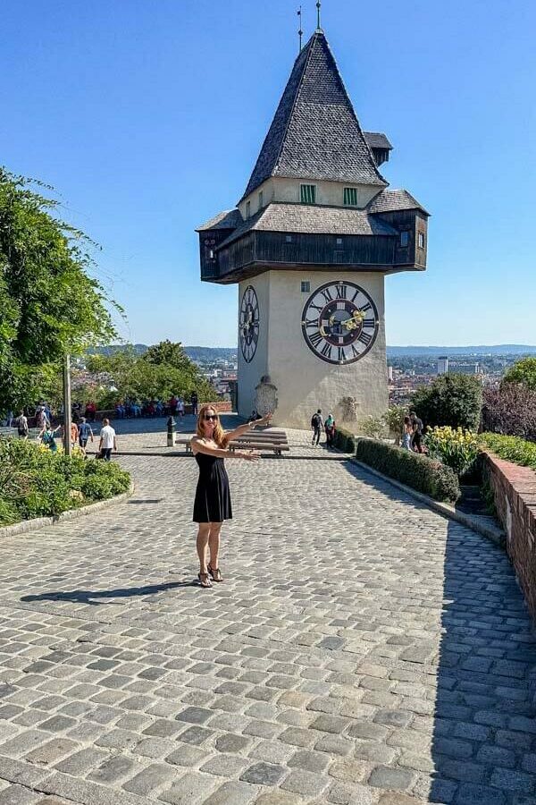 Veronika posing in front of Graz' famous clock tower called Uhrturm