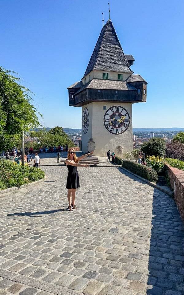 Veronika posing in front of Graz' famous clock tower called Uhrturm