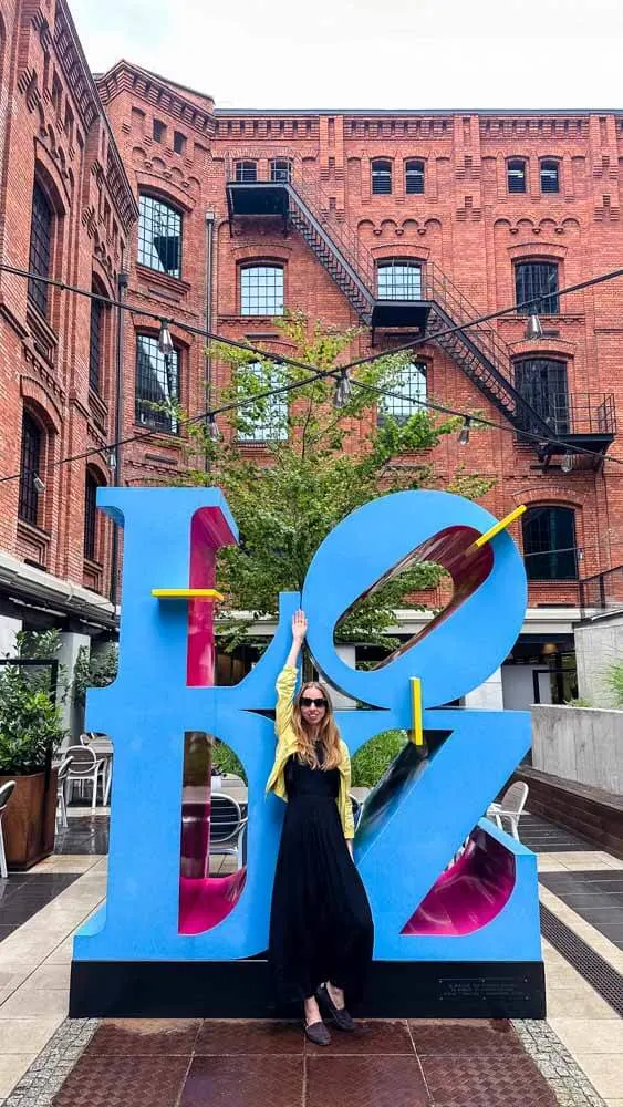 Veronika posing with the sign of Lodz