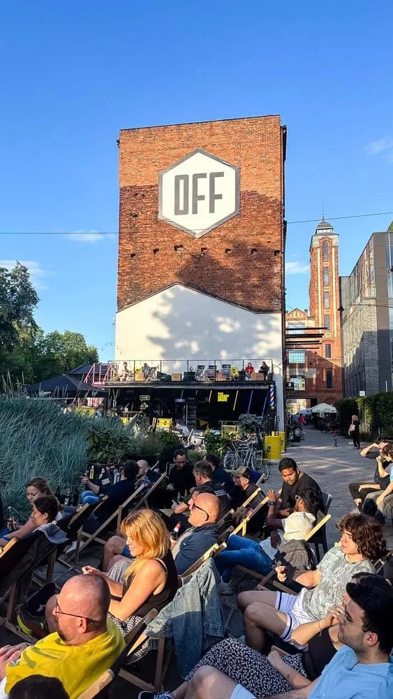 People watching something on a screen at OFF Piotrkowska venue in Lodz Poland